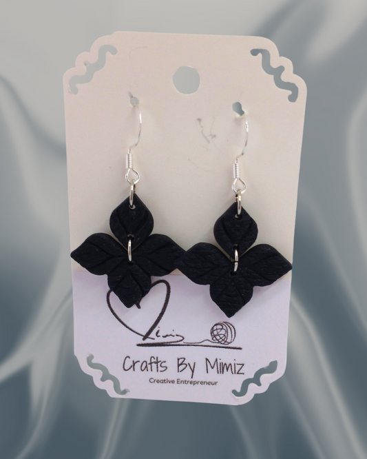 Handmade polymer clay clover earrings in black with sterling silver hooks